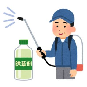 除草剤を撒く男性